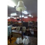 A beech standard lamp and a pair of Art Deco style wall lights