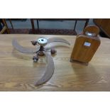 A teak ceiling fan and set of teak cheese coasters