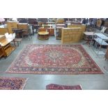 A Persian red ground Tabriz rug, 346 x 250cms