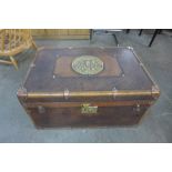 A brown leather trunk, with Milners Patent Fire Resistant plaque to top