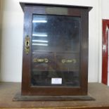 A small Edward VII oak smokers cabinet