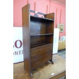 An Arts and Crafts mahogany newspaper stand