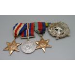 Three WWII medals and a London Scottish cap badge