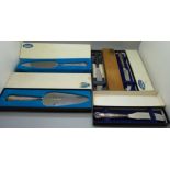 Five silver handled servers/knives, boxed