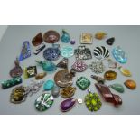 A collection of pendants including Murano glass