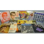 Twelve pop music EP records including Buddy Holly, Searchers, Beatles, etc.