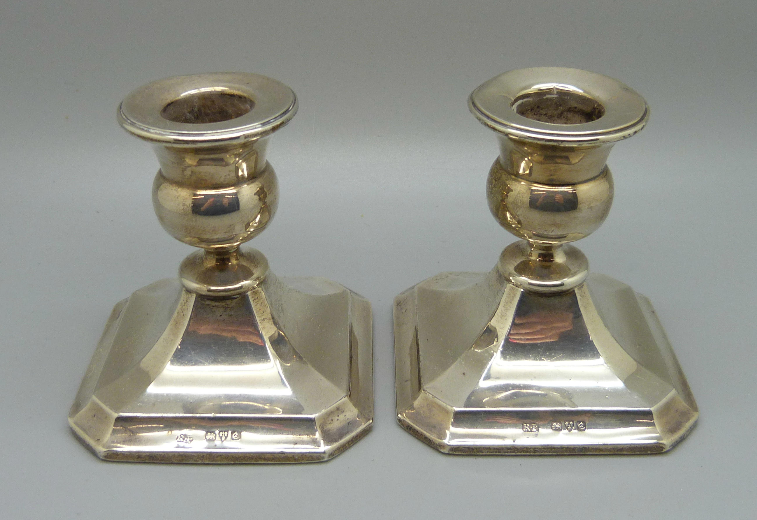 A pair of small silver candlesticks, Chester 1930