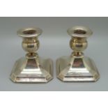 A pair of small silver candlesticks, Chester 1930