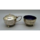 A large hallmarked silver mustard and salt, with blue glass liners, 183g
