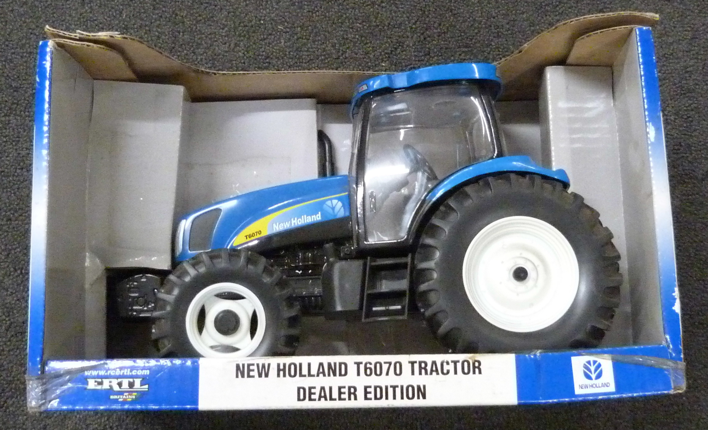 An Ertl New Holland T6070 die-cast model Tractor, dealer edition, boxed