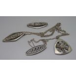 Three pewter pendants and a brooch, all marked Scotland