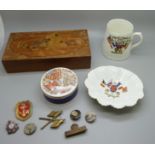 Sutherland china 1914 commemorative dish, a similar mug, a pot, a collection of badges and a