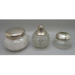 Two silver topped glass jars, weighable silver 38g, and a silver topped glass scent lacking spray