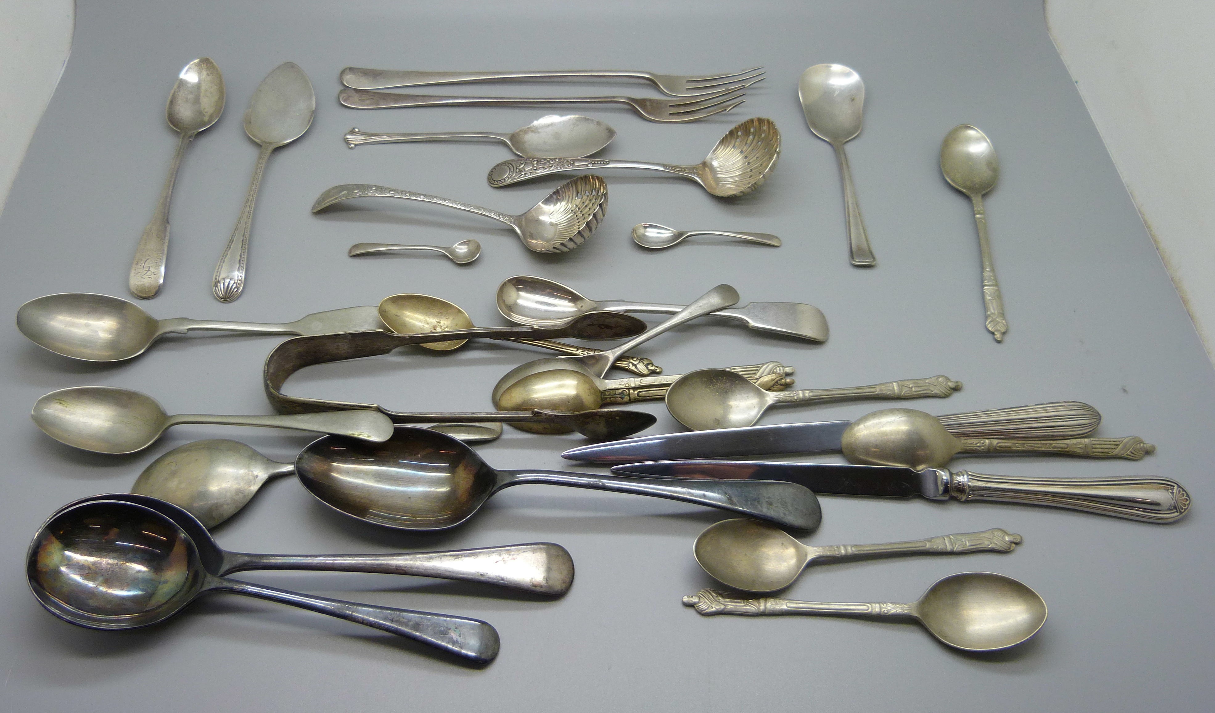 Two silver sifter spoons, two silver pickle forks, six other silver spoons and plated ware, silver