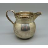 A hallmarked silver cream jug, 79g