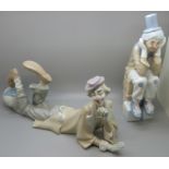 A Lladro figure of a clown lying down and a Casades figure of a seated clown, (2)