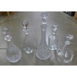 Two cut glass decanters and three plain glass decanters **PLEASE NOTE THIS LOT IS NOT ELIGIBLE FOR