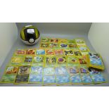 Eighty 1995-2000 Pokemon cards, in Pokeball tin