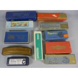 A collection of harmonicas including German, Italian, etc.