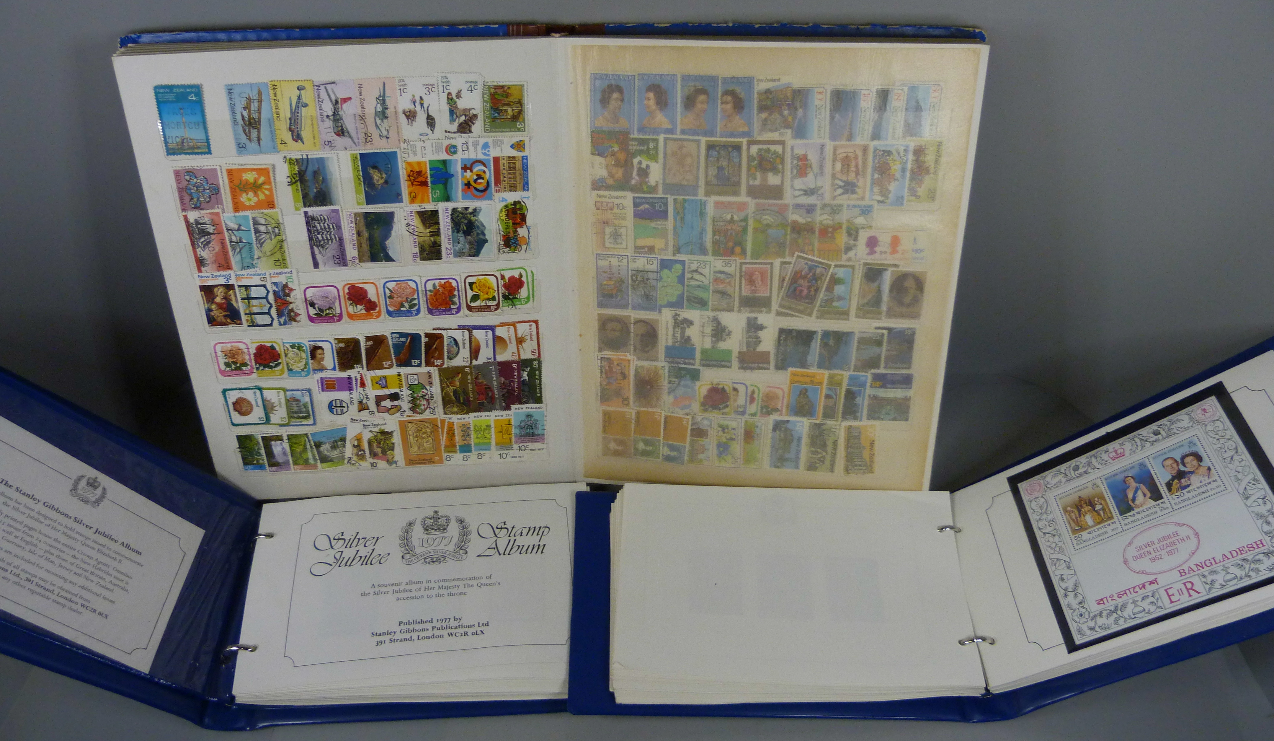 Three stamp albums, two Stanley Gibbons Silver Jubilee and an album containing New Zealand and