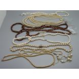 A collection of pearl necklaces and bracelets, two with 925 silver fasteners