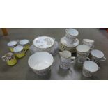 An early 20th Century tea service, ten plates, ten saucers, eight cups, cream and sugar, some a/f,