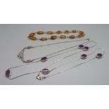 A silver and amber necklace, a marcasite necklace and one other necklace