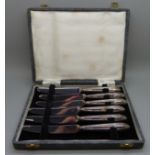 Six silver handled butter knives, H. Hunt, Sheffield 1935