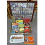 A 1973-74 FA Year Book, a Football League Review, tins and a set of framed cigarette cards, Player's