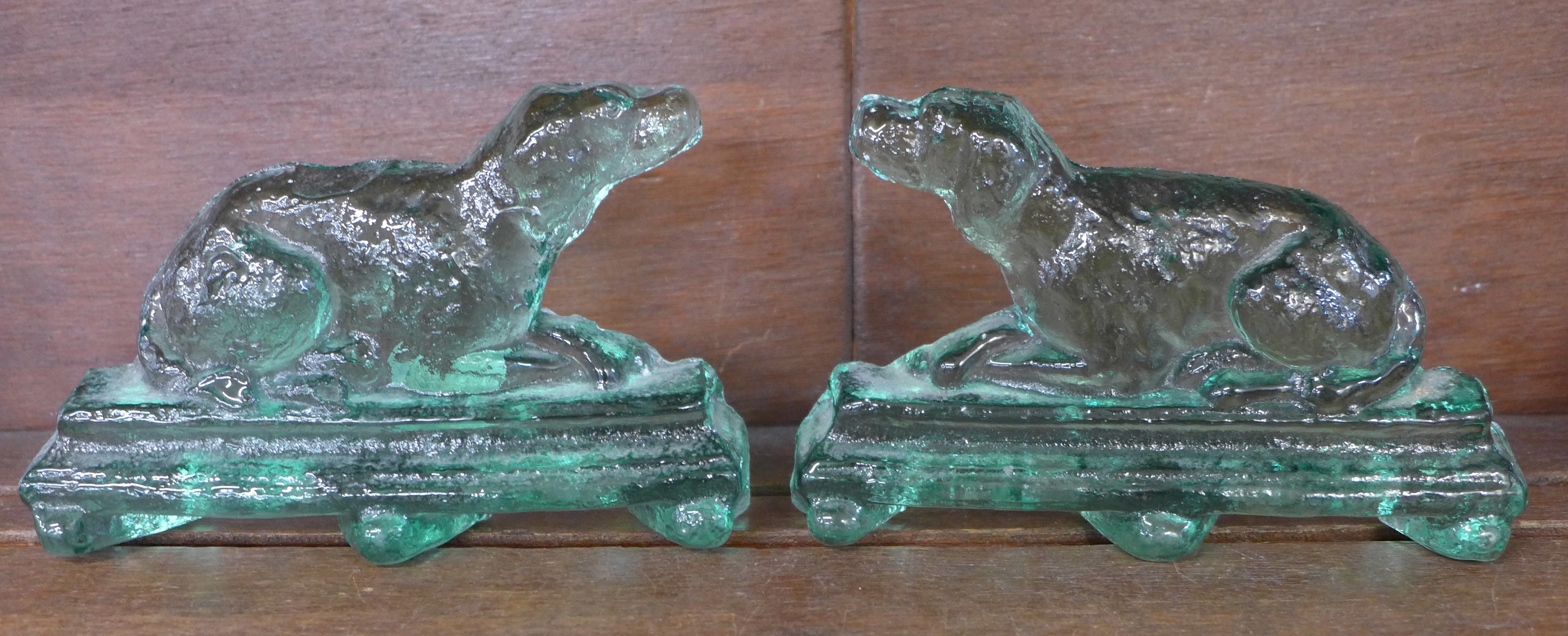 A pair of green glass dog bookends, 16.5cm, a/f - chips to base