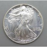 A 1992 United States 1 ounce fine silver Liberty one dollar coin