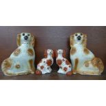 Two pairs of Staffordshire spaniels, one of smaller pair cracked