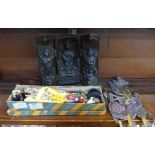 A Chinese folding shrine, a Tibetan shadow puppet with horn handle and two boxed puppets