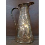 An Art Nouveau copper pitcher, 29cm