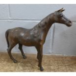 A Liberty & Co. style leather model of a horse, 30cm