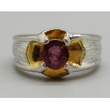 A plated ring with red stone, W