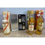 Four bottles of whisky; Angus McKay, Grant's x2 and The Famous Grouse