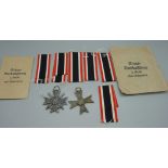 Two WWII German Merit Cross, one with and one without swords