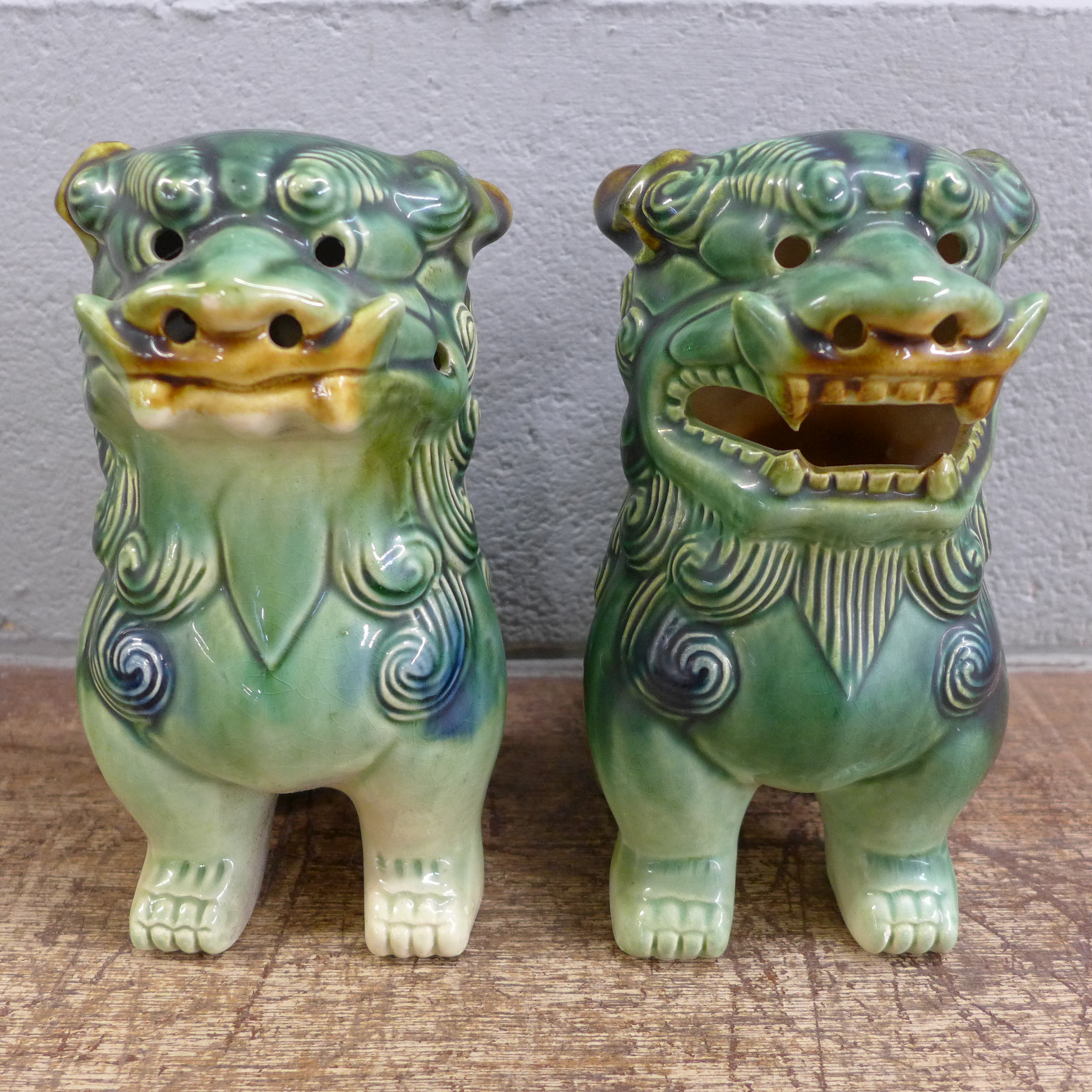 A pair of green Chinese dogs of foe, 19cm