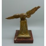 A 1930's desk pocket watch holder, the gilt metal eagle with outstretched wings, on marble base,