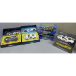 Four Scalextric GT40 cars and two other model GT40 cars, all boxed