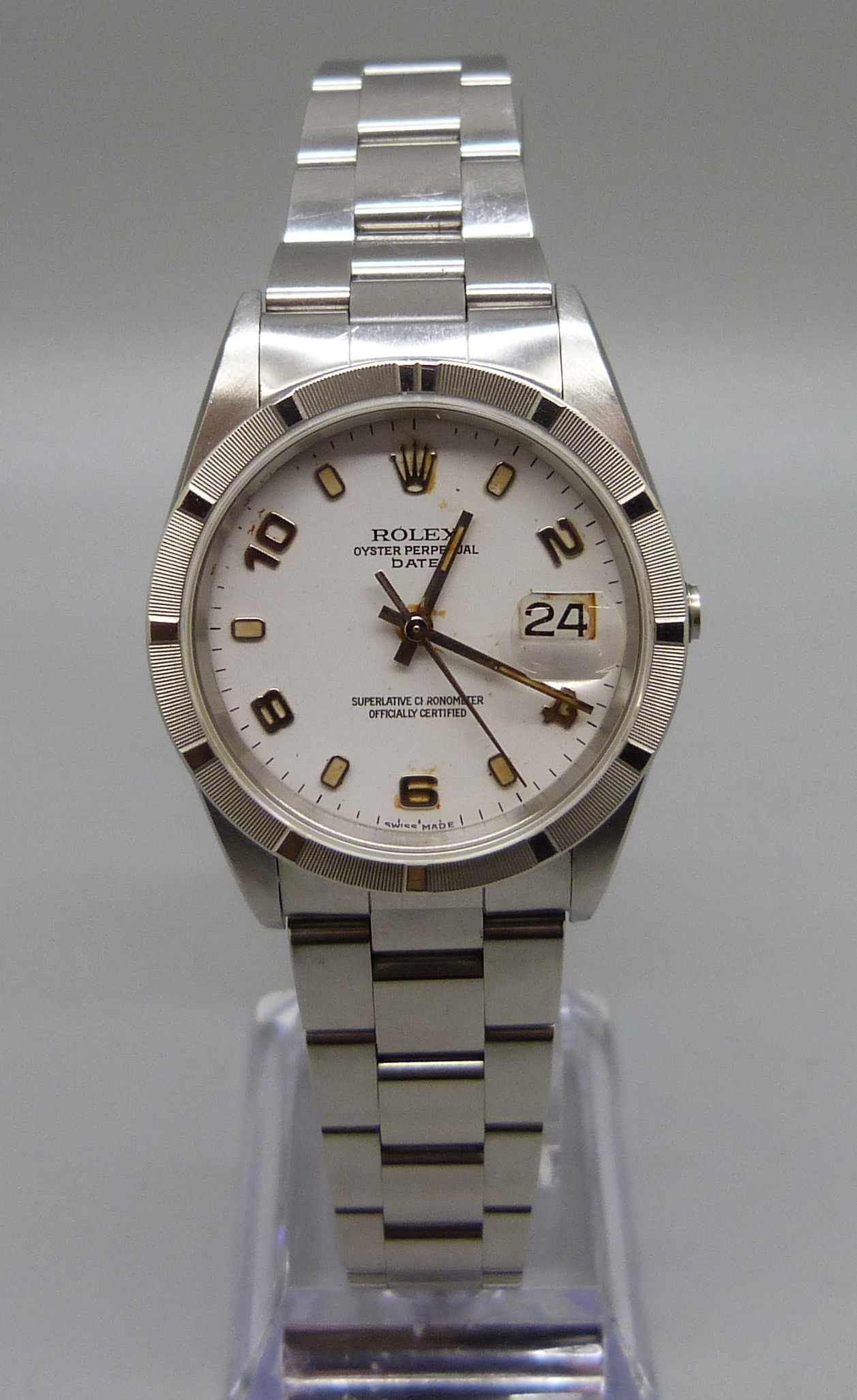 A Rolex Oyster Perpetual Date wristwatch, boxed with papers, lacking crown