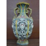 An English majolica baroque vase with raised decoration, rim a/f, 29.5cm