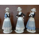 Three figures of Dutch girls in traditional dress, 26cm