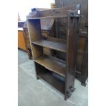 A small Arts and Crafts oak open bookcase