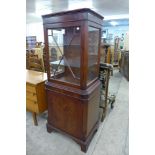 A mahogany display cabinet