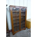 An Edward VII walnut two door bookcase