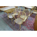 A set of four Ercol Blonde elm and beech Windsor elbow chairs