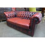 An oxblood leather Chesterfield Settee