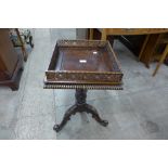 A Chippendale style carved mahogany urn stand